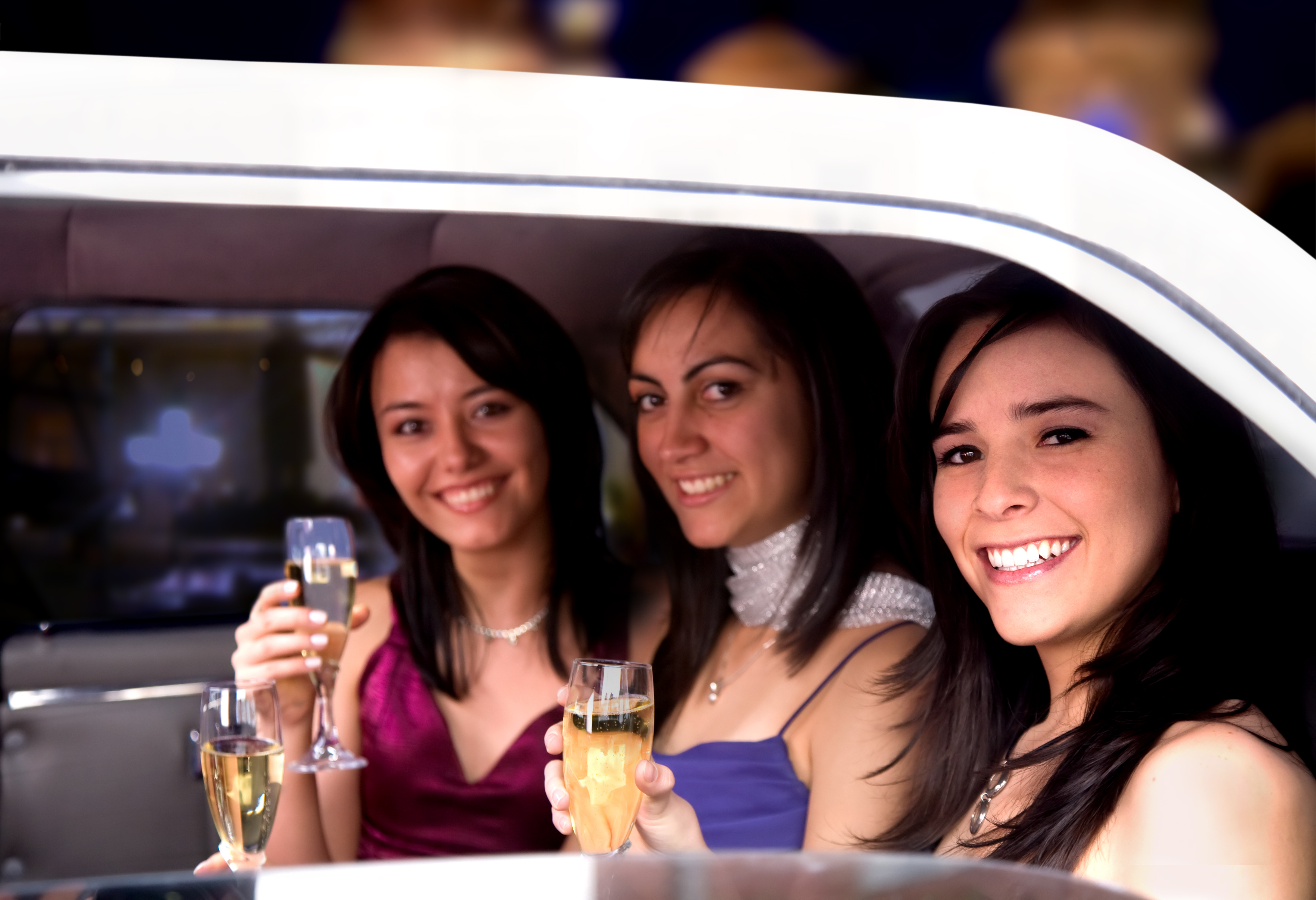 girls drinking in a night out in a limousine